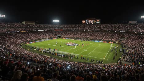 a captivating evening at the stadium: fans illuminate the night with lights while players gather for a memorable moment on the field