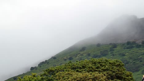 Scenic-Wales-misty-moody-fog-atmosphere-sweeping-across-mountain-countryside-rural-scene