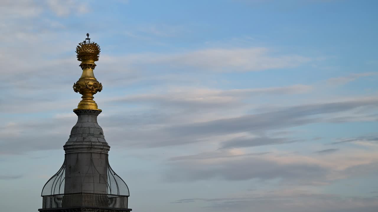 Clouds and Planes Going Past the Monument to the Great Fire of London, United Kingdom