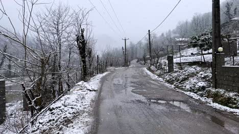 empty road in gravel rural village winter snow heavy fall in mountain cabin in countryside iran hyrcanian wide landscape freezing nature farm wooden cottage livestock people driving lifestyle in woods