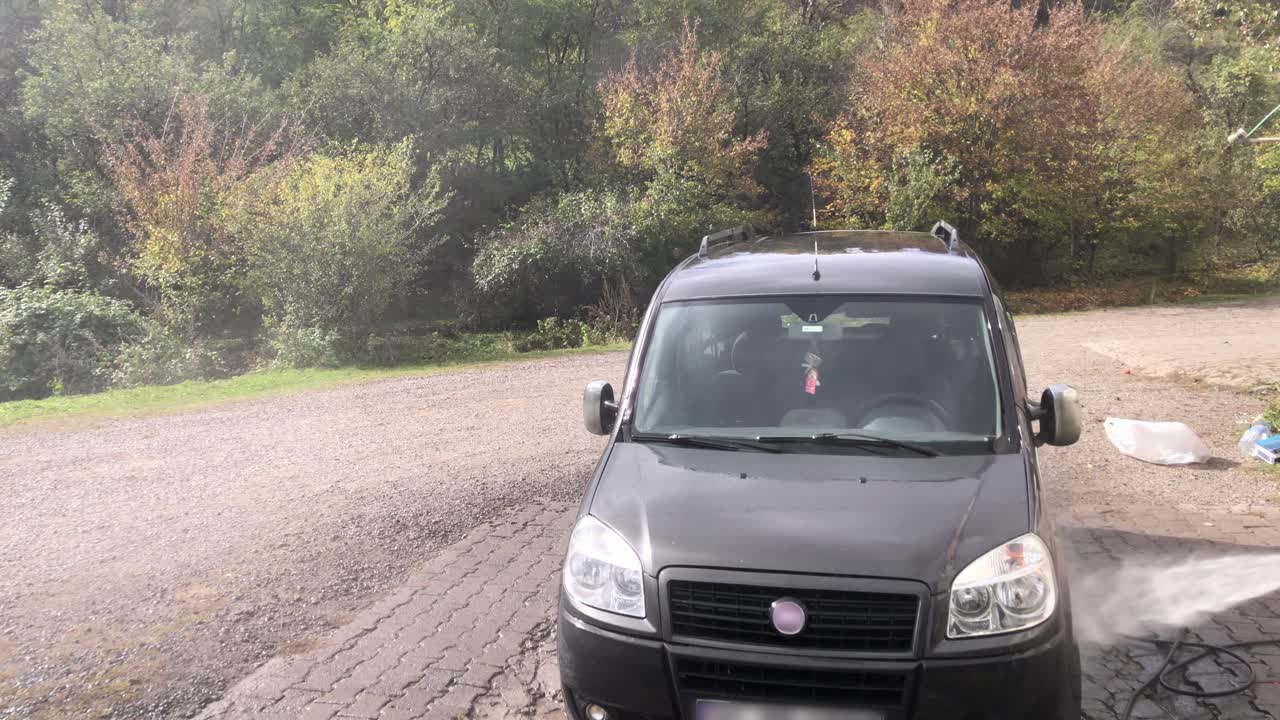 washing the car with fresh water in a car wash