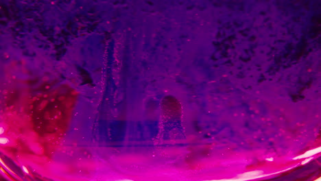 abstract close-up of colored liquid with ice