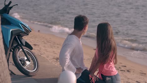 beautiful young couple with brown hair chats and laughs