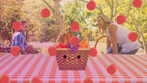 Animation-of-pink-spots-over-picnic-basket-on-gingham-and-caucasian-mother-and-daughter-in-park