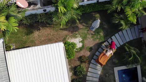 Aerial-descending-drone-shot-man-getting-massage