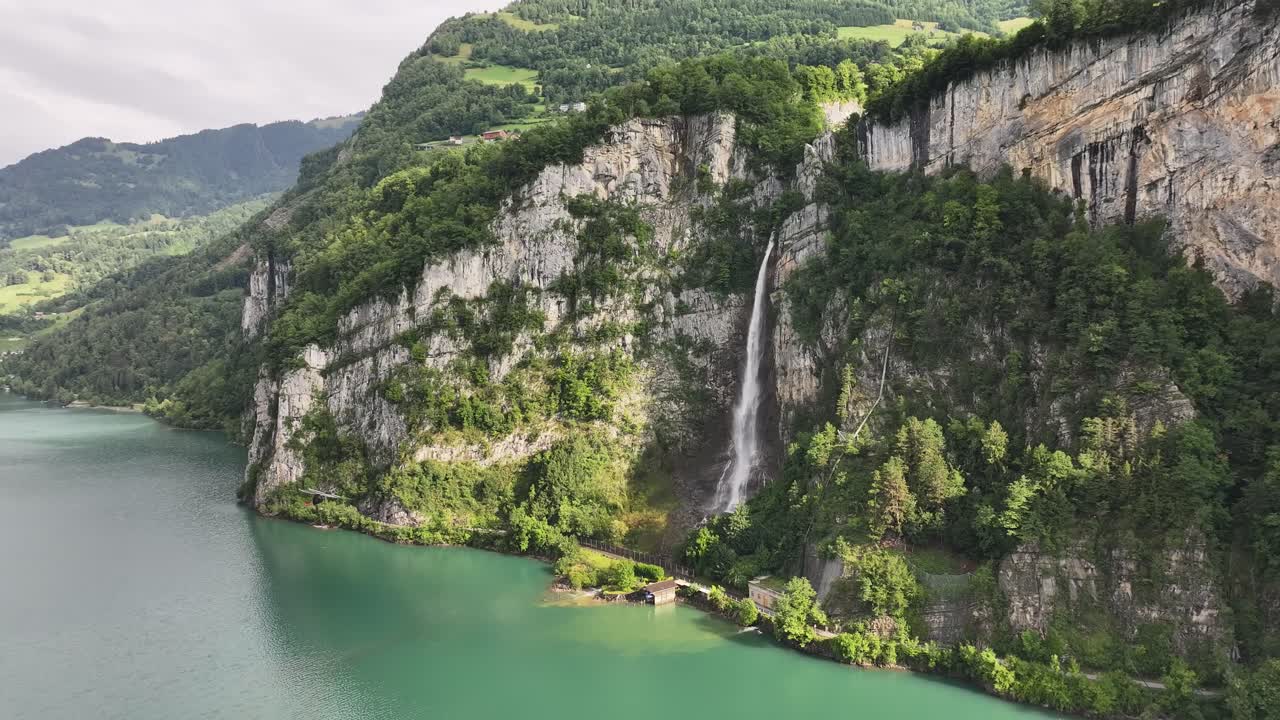 Breathtaking aerial view of Seerenbachfälle waterfalls cascading into Walensee in Switzerland