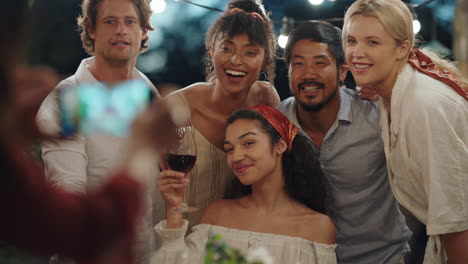 dinner party friends posing for photo celebrating friendship enjoying reunion gathering making memories on summer evening outdoors 4k