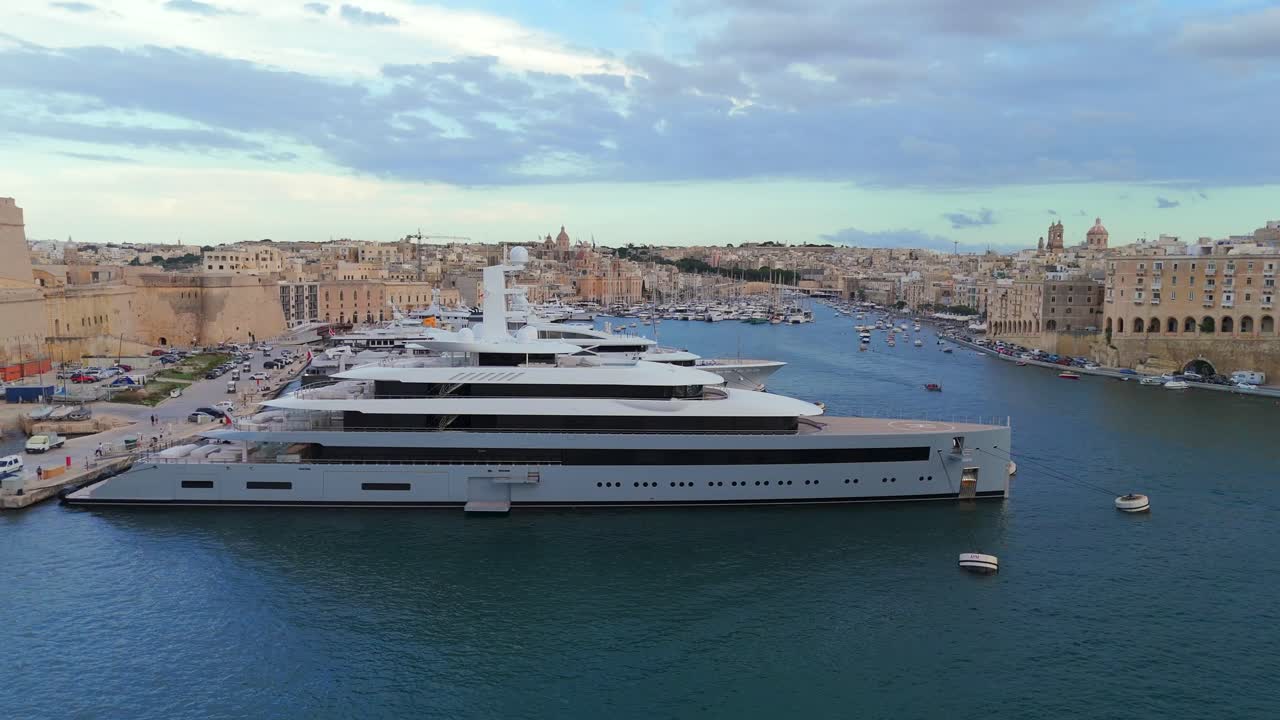 Sweeping aerial shots highlight Valletta’s impressive fortifications, ornate buildings, and picturesque streets.