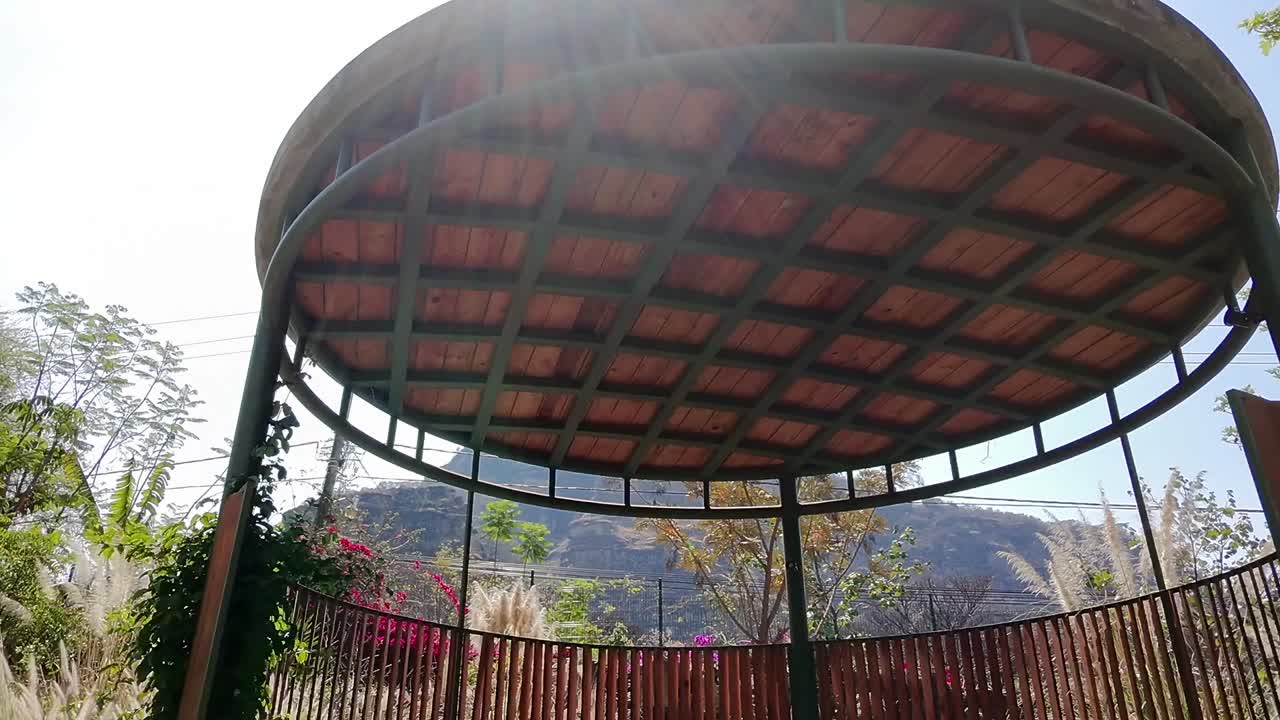 Pull out shot of a patio in a garden with the sun shining during the day in Tepoztlan, state of Morelos, Mexico, outdoor