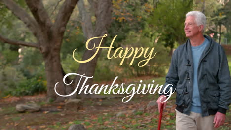 happy thanksgiving text animation over elderly man walking in park with cane