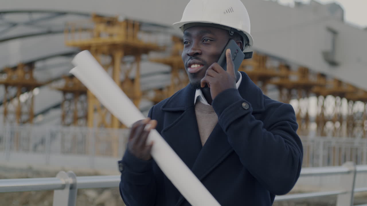 Engineer Talking on Phone at Construction Site