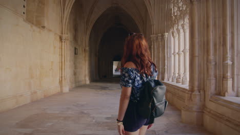 monastery of batalha girl walks the corridors of the monastery gimbal shot