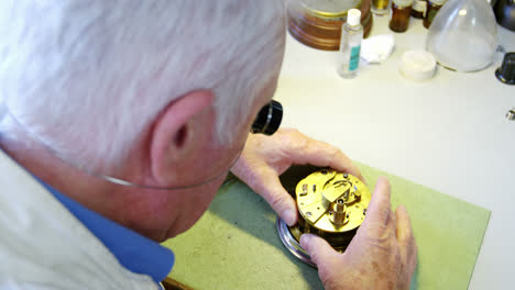 horologist repairing a watch