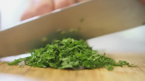 close up of mint being finely chopped by chef