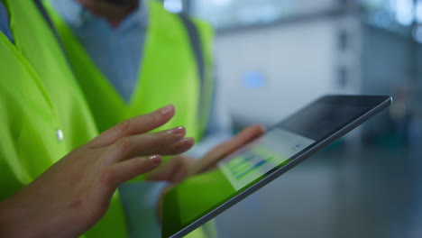 Closeup-storage-workers-tablet-data-checking-manufacture-inspection-process.