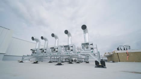 the air conditioning and ventilation system of a large industrial facility is located on the roof. it includes an air conditioner, smoke exhaust, and ventilation.