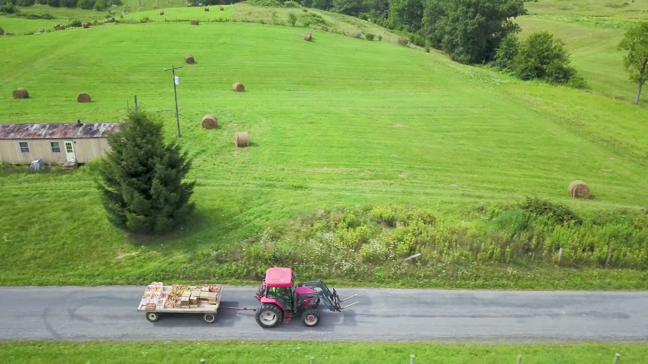 Tractor pulling a trailer in a field
