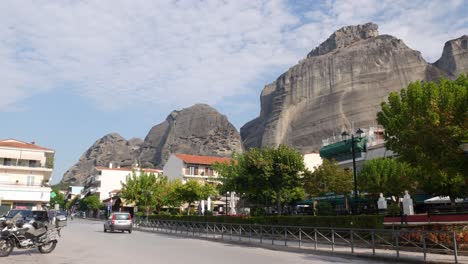 locked shot of the riga fereou square with the meteora mountains in the background