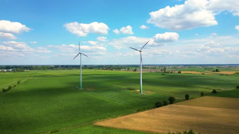 aerial view of powerful wind turbine farm for energy production on beautiful cloudy sky at highland