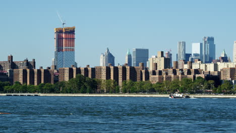 panoramic view of manhattan skyline and williamsburg bridge