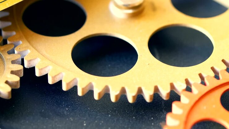 clock 's mechanism: wheels spinning together-macro