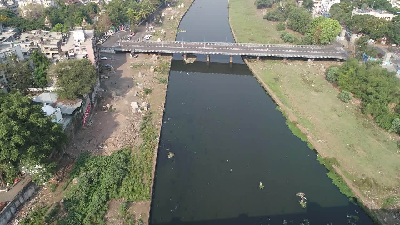 Aerial View of a River and Bridge in an Indian City