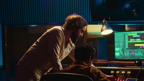 diverse team of musician and audio technician creating a hit song
