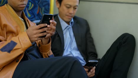 commuters using mobile phone while travelling in bus 4k