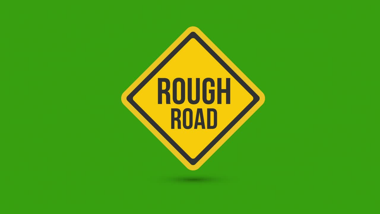 rough road yellow road sign