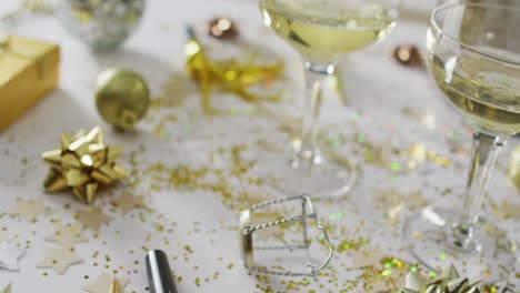 Champagne-glasses-and-decorations-on-white-background-at-new-year's-eve