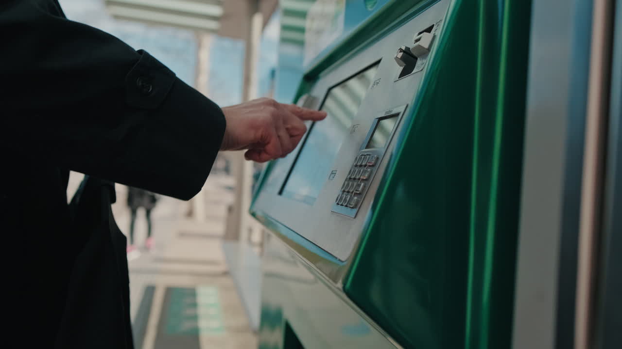 Person Using Ticket Vending Machine, male hand