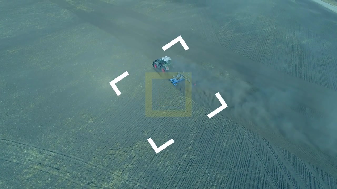 Aerial Shot of Tractor Plowing Field with Digital Target Overlay