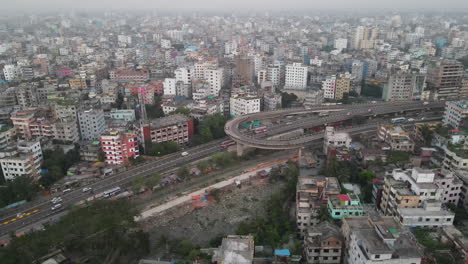 timelapse of aerial city highway with u loop flyover