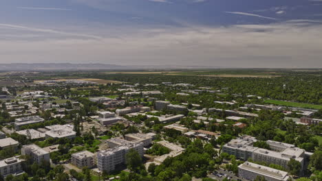 davis california aerial v1 panoramic view drone flyover uc davis campus area, a renowned public land-grant research university on a sunny day with blue sky - shot with mavic 3 cine - june 2022