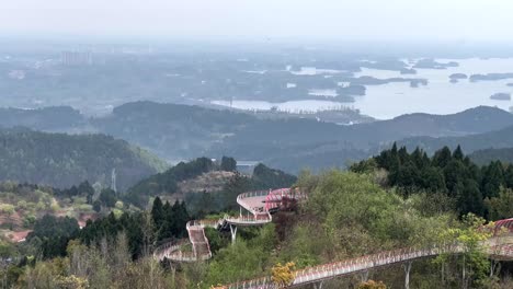 the panoramic view overlooking chengdu, the longquan danjingtai eye-shaped platform offers a unique aerial view of lush landscapes, blending architecture with nature for a mesmerizing experience