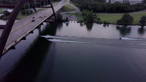 three jet skis racing down lake travis in austin, texas