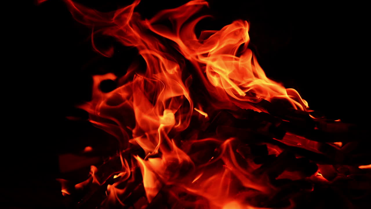 Firewood beautiful scenery. Red flame on dark background.