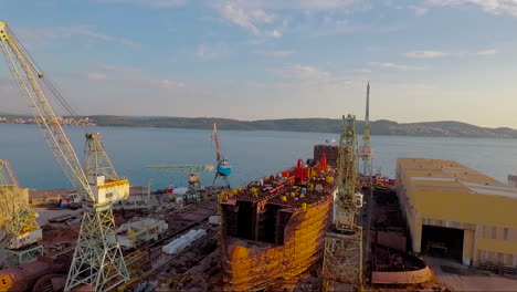 an aerial over a shipyard with large boats being built in croatia 3