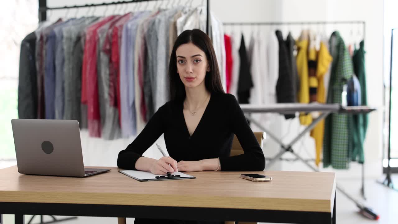 Woman working at a dry cleaner or clothing business