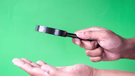 young women discovering his luck with magnifying glass