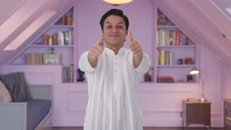 happy indian man showing thumbs up