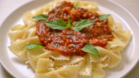 farfalle-pasta-with-basil-and-garlic-in-tomato-sauce---Italian-food-style