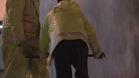 firemen try to shut of a broken water main in los angeles 5