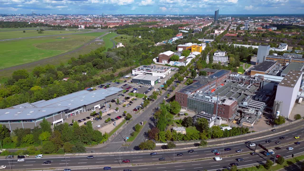 Aerial view of a city with highways and buildings
