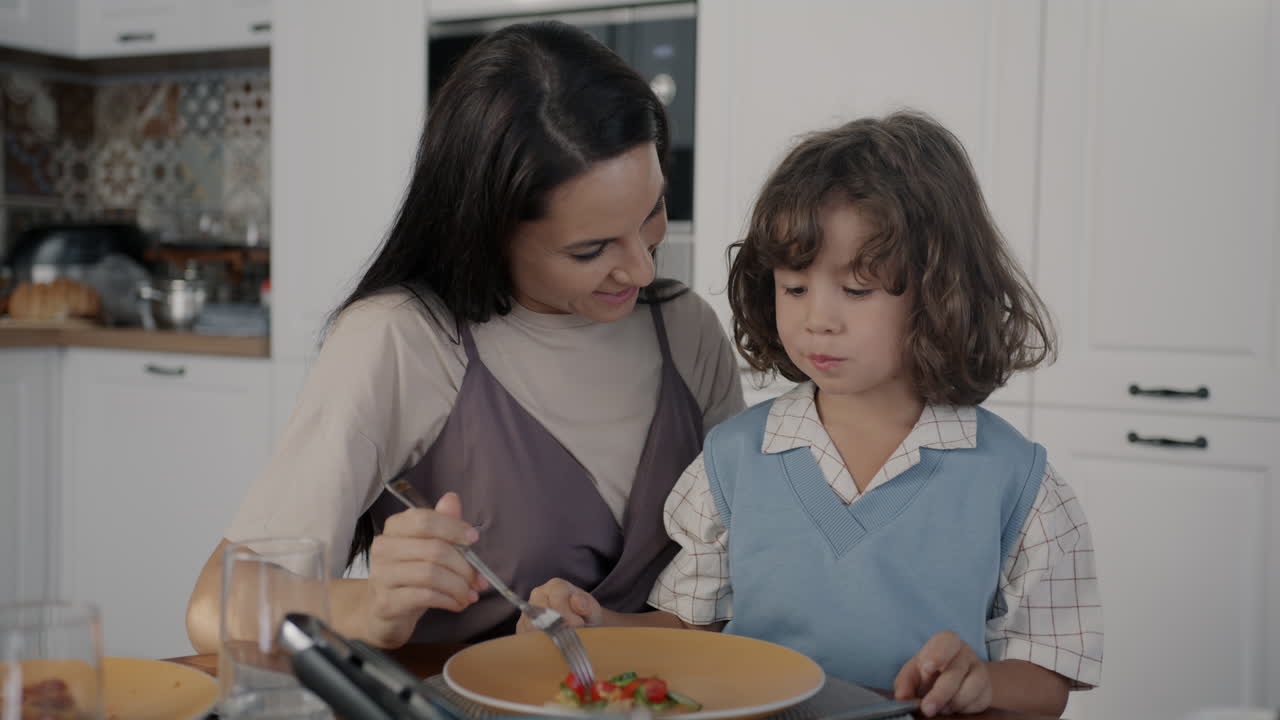 Mother and Son Enjoying a Meal Together