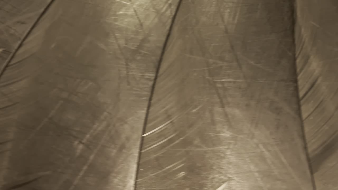bags and suitcases move along conveyor belt in the baggage reclaim hall at the airport