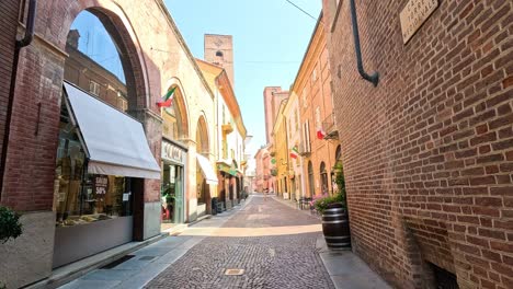 a bustling shopping street in piedmont, italy