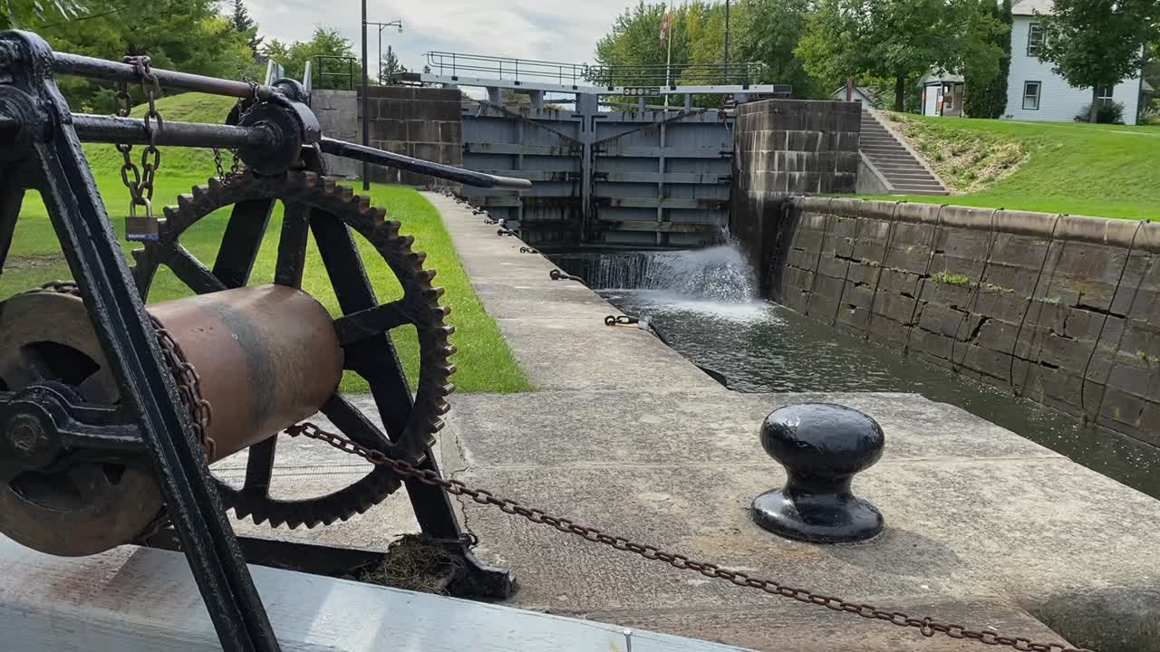 Empty Rideau Canal waterway locks with water leaking through gate