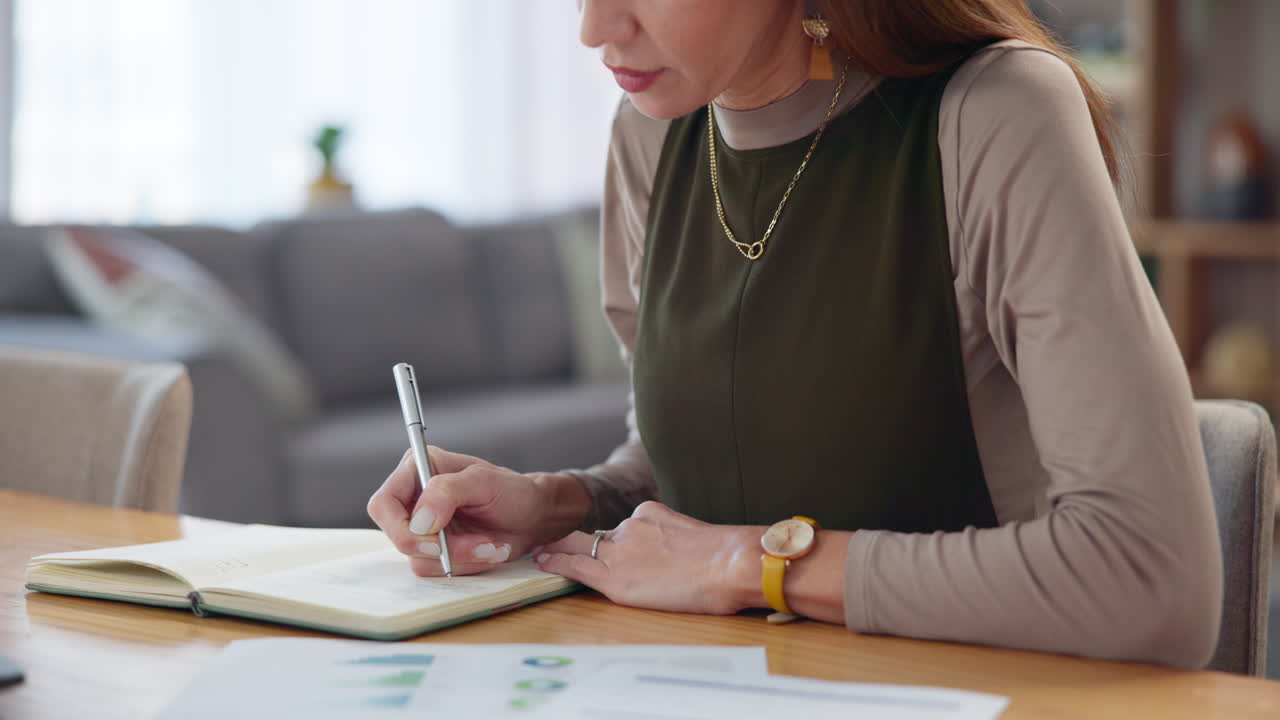 Woman Working on Laptop at Desk