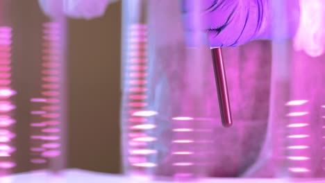 filling pipette with blood for dna analysis showing infection results on coronavirus patients on a medical laboratory